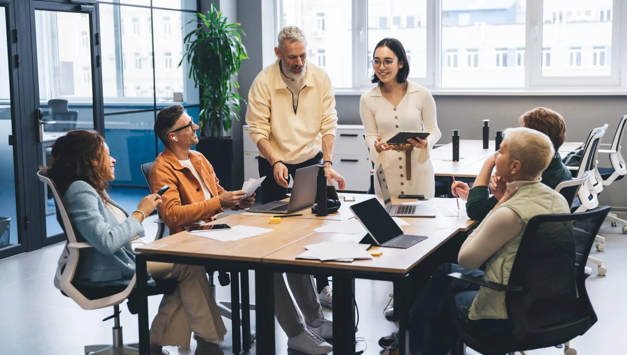 A team in a meeting at a table in an office